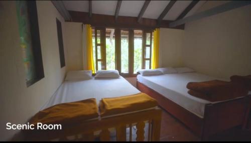 Katil atau katil-katil dalam bilik di Saaranga homestay