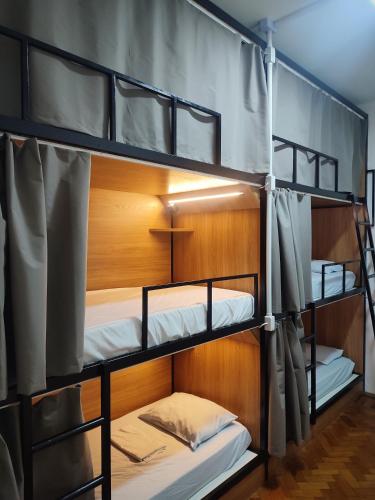 a group of bunk beds in a room at Hostel Casarão 65 in Salvador
