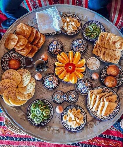 a tray of different types of food on a table at Art Riad Au Bord De La Mer in El Jadida