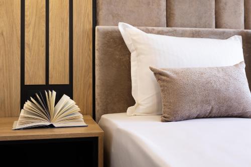 Voodi või voodid majutusasutuse AMAR Design Hotel by HMG toas