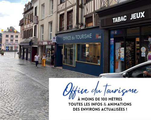 a sign on a street in a city with buildings at Funny and Friendly - Billard et Suite in Pont-Audemer