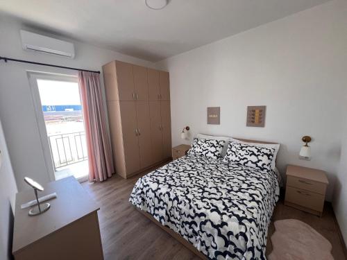 Ένα ή περισσότερα κρεβάτια σε δωμάτιο στο Golden Heart Apartments