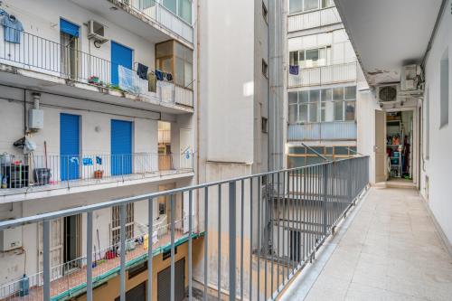 a corridor of an apartment building with balconies at Charming Apartment Near Villa Bellini in Catania in Cibali
