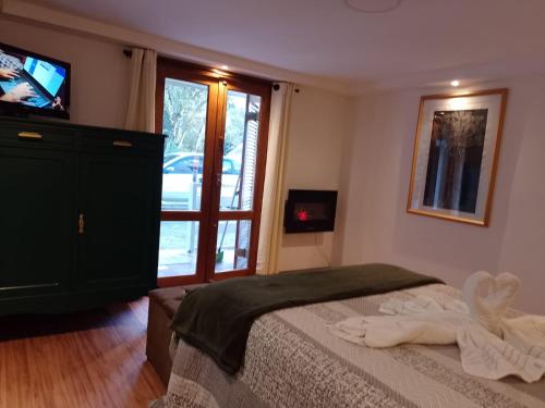 TV a/nebo společenská místnost v ubytování Casa do Papai