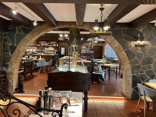 a restaurant with a piano in the middle of a room at La Vista Verde vom La Fattoria in Bad Gandersheim