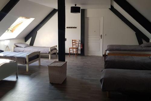 Postel nebo postele na pokoji v ubytování Gîte de la châtaigneraie