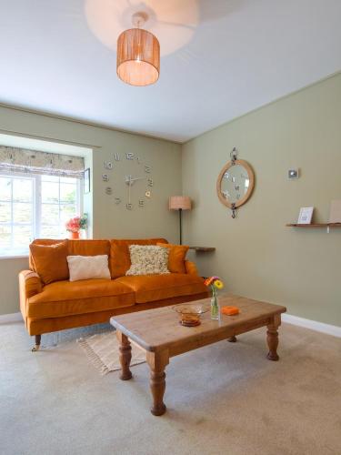 a living room with a couch and a coffee table at The Lilley Pad in Ludlow Cosy, Central, Perfect for Couples, Netflix & Parking Permit in Ludlow
