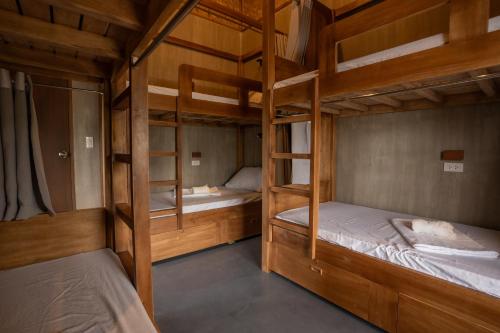 a bunk bed room with two bunk beds at The Circle Hostel, La Union in San Fernando