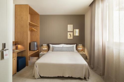 Letto o letti in una camera di Hotel Casa Teva Barcelona