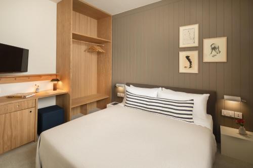 Letto o letti in una camera di Hotel Casa Teva Barcelona