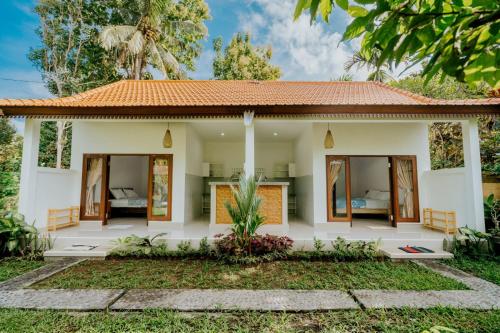 a villa with a bedroom and a garden at umahananda in Mambat