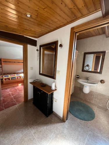 a bathroom with a sink and a toilet in a room at Casa Romeo in Brion