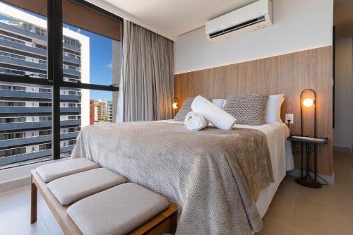 Postel nebo postele na pokoji v ubytování Way Tambaú - Studios Deluxe em João Pessoa por Carpediem