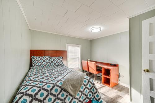 a bedroom with a bed and a desk at Lake Guntersville Home 1 Mi to Boat Ramp! in Guntersville