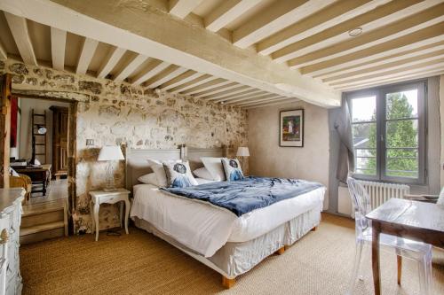 Postel nebo postele na pokoji v ubytování La Maison des Muses