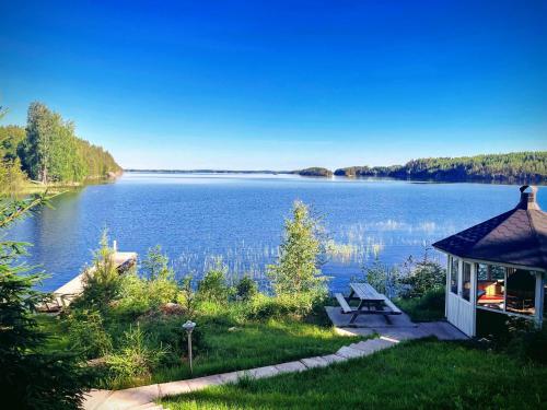 a gazebo with a view of a lake at Saimaa Raikala in Vuoriniemi