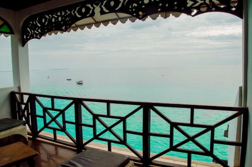 a view of the ocean from a balcony at Langi Langi Beach Bungalows in Nungwi