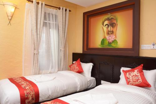 Postel nebo postele na pokoji v ubytování Kasthamandap Boutique Hotel