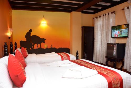 Postel nebo postele na pokoji v ubytování Kasthamandap Boutique Hotel