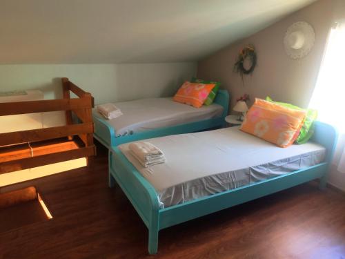 Postel nebo postele na pokoji v ubytování Sunset Apartments