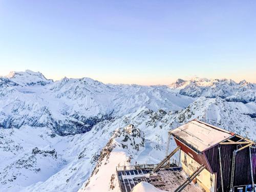 a view from the top of a snow covered mountain at Apartment Aiglon J2 by Interhome in Nendaz