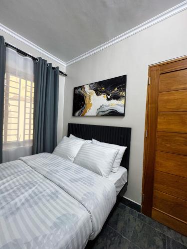 Ένα ή περισσότερα κρεβάτια σε δωμάτιο στο Phdhomes