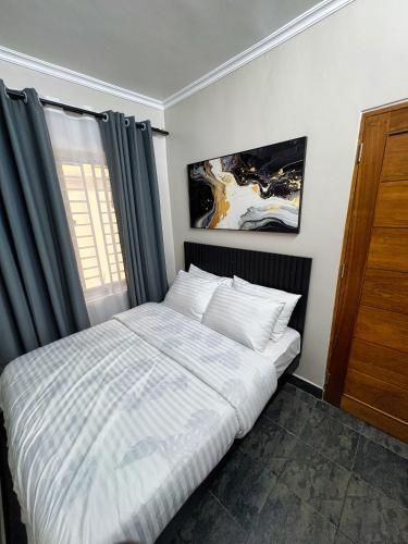 Ένα ή περισσότερα κρεβάτια σε δωμάτιο στο Phdhomes
