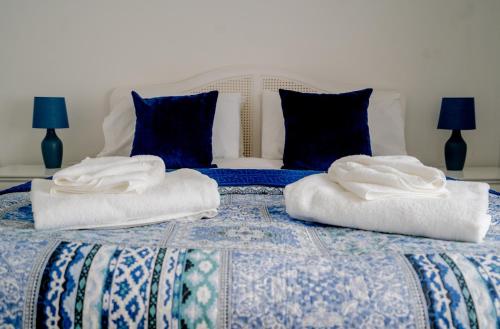 a bed with two towels on top of it at Cottage in Ludlow in Ludlow