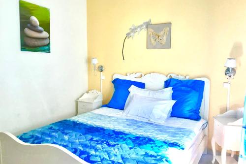 villa Ginetto tesisinde bir odada yatak veya yataklar
