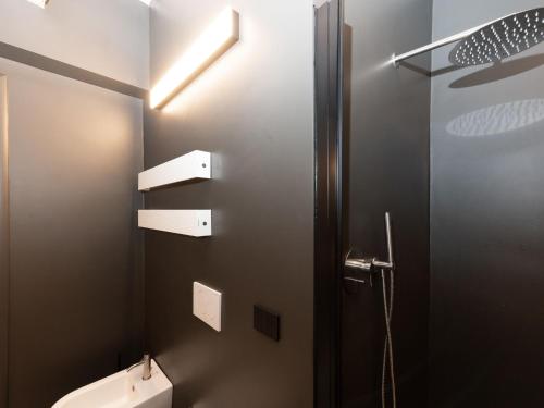 a bathroom with a toilet and a door with a light at Holiday Home Oasi di benessere Bio by Interhome in Sassofortino