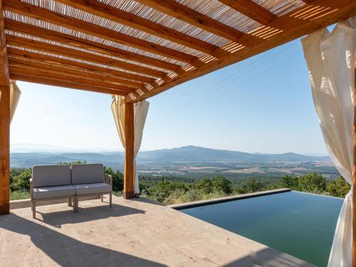 a swimming pool in a house with a wooden roof at Holiday Home Oasi di benessere Bio by Interhome in Sassofortino