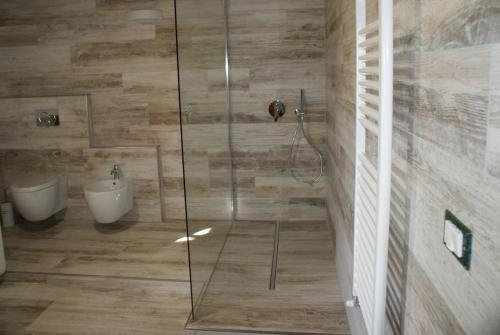 a bathroom with a shower with a toilet and a sink at Tuscany country house, Poggio Vitale in Lorenzana