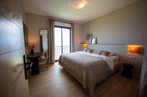 Ένα ή περισσότερα κρεβάτια σε δωμάτιο στο Villa vue mer Cap Corse