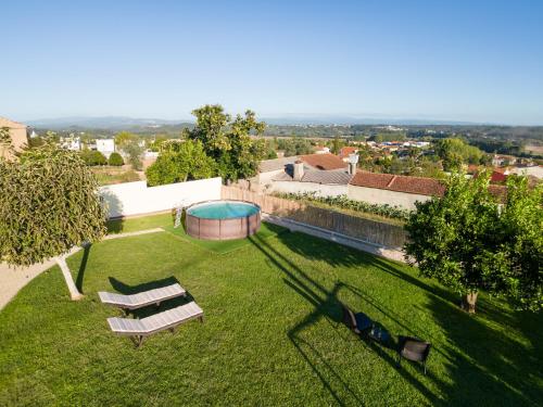 an overhead view of a garden with two benches and a gazebo at A Casa da Bela Vista in Aveiro