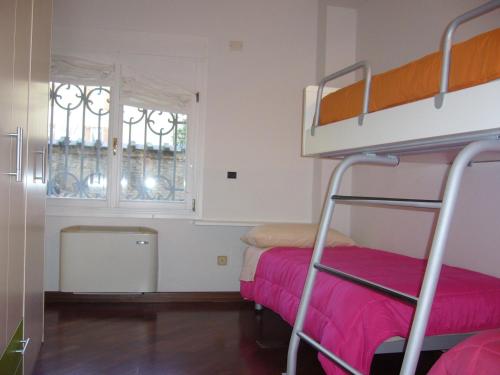 A bed or beds in a room at IL CASTELLO HOSTEL BOUTIQUE
