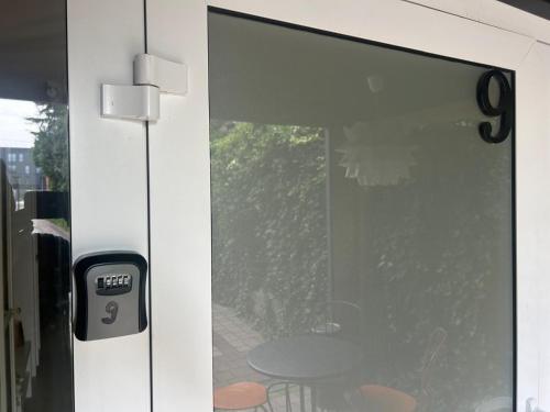 a sliding glass door with a table behind it at Willa 1936 , Parking in Toruń