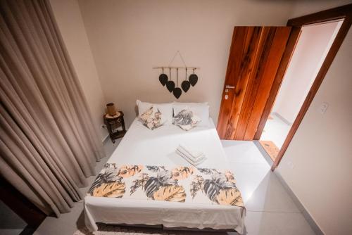 Ένα ή περισσότερα κρεβάτια σε δωμάτιο στο Pousada Hymbe