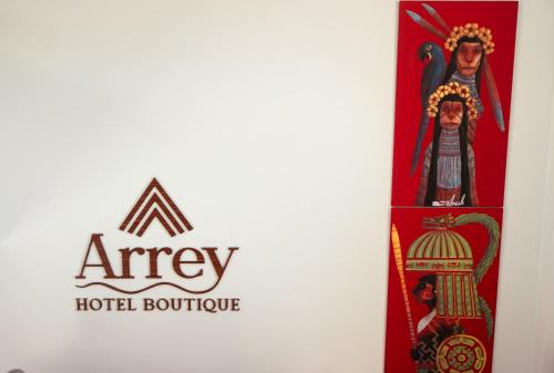 a group of three tarot cards with a abey hotel boutique logo at Arrey Boutique Hotel in Barra Grande