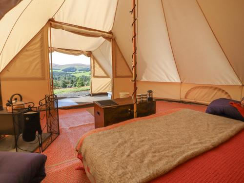 Una cama o camas en una habitación de Gypsy Glen