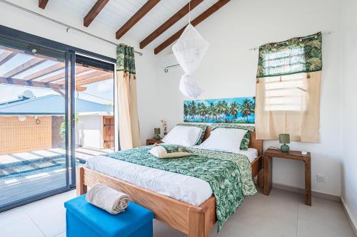 A bed or beds in a room at Gîte Dalina