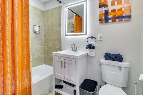 a bathroom with a sink and a toilet and a shower at Central Albuquerque Getaway with Hot Tub and Grill! in Albuquerque