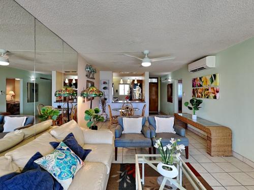 a living room with a couch and a table at Menehune Shores 206 in Kihei