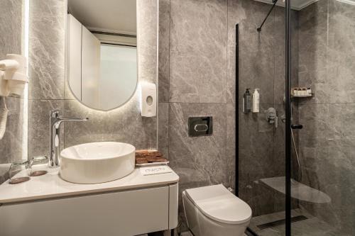 Salle de bains dans l'établissement Awen Lara Hotel