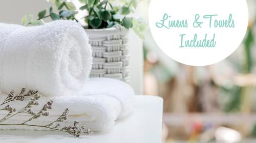a white wedding cake with a white robe on it at Semi-Oceanfront, Close to Beach Access! SA2, Wadel in Sanderling