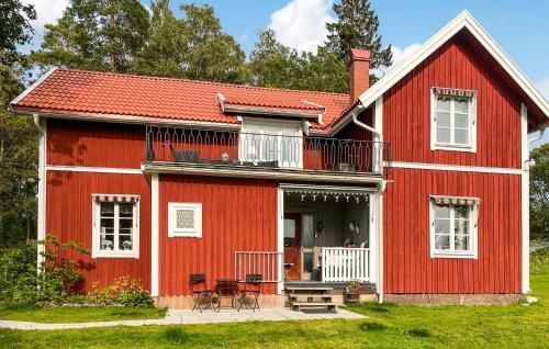 a red house with a red roof at 2 Bedroom Awesome Home In Storfors in Storfors