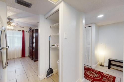 a bathroom with a walk in closet and a room at Largo Sunrise in Largo
