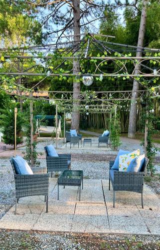 a group of benches with blue pillows on them at ZAPPI CYCLING HOTEL in Riolo Terme