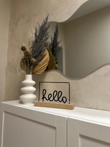 a white shelf with a sign that says reed on it at Apartment Forest in Otočac