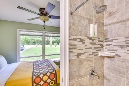 a master bathroom with a bed and a shower at 5 Mi to Warren Dunes - Secluded Sawyer Home! in Sawyer