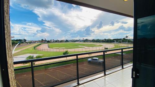a view from a window of a parking lot at Hotel Nova Aliança in Chapadão do Sul
